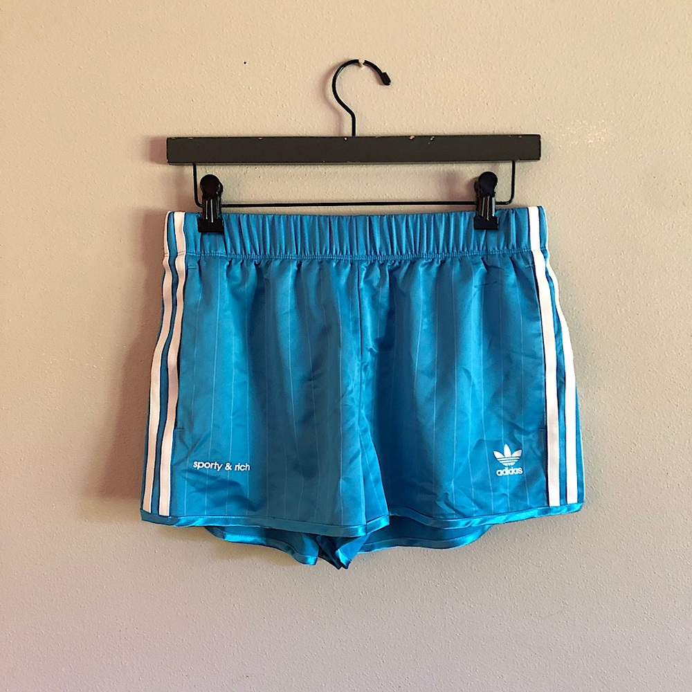 🦋 sporty & rich adidas women’s track shorts sky blue